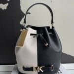 MICHAEL KORS REED MEDIUM TWO TONED PEBBLED LEATHER BUCKET BAG (BLACK MULTI)