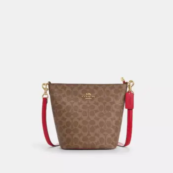 Coach Logan Duffle Bag In Signature Canvas (Tan Carnation)