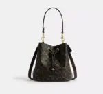 Coach Rowan Bucket Bag In Loved Signature Canvas With Charms (Brown)