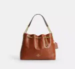 Coach Evelyn Shoulder Bag With Quilting And Charm (Cinnamon)